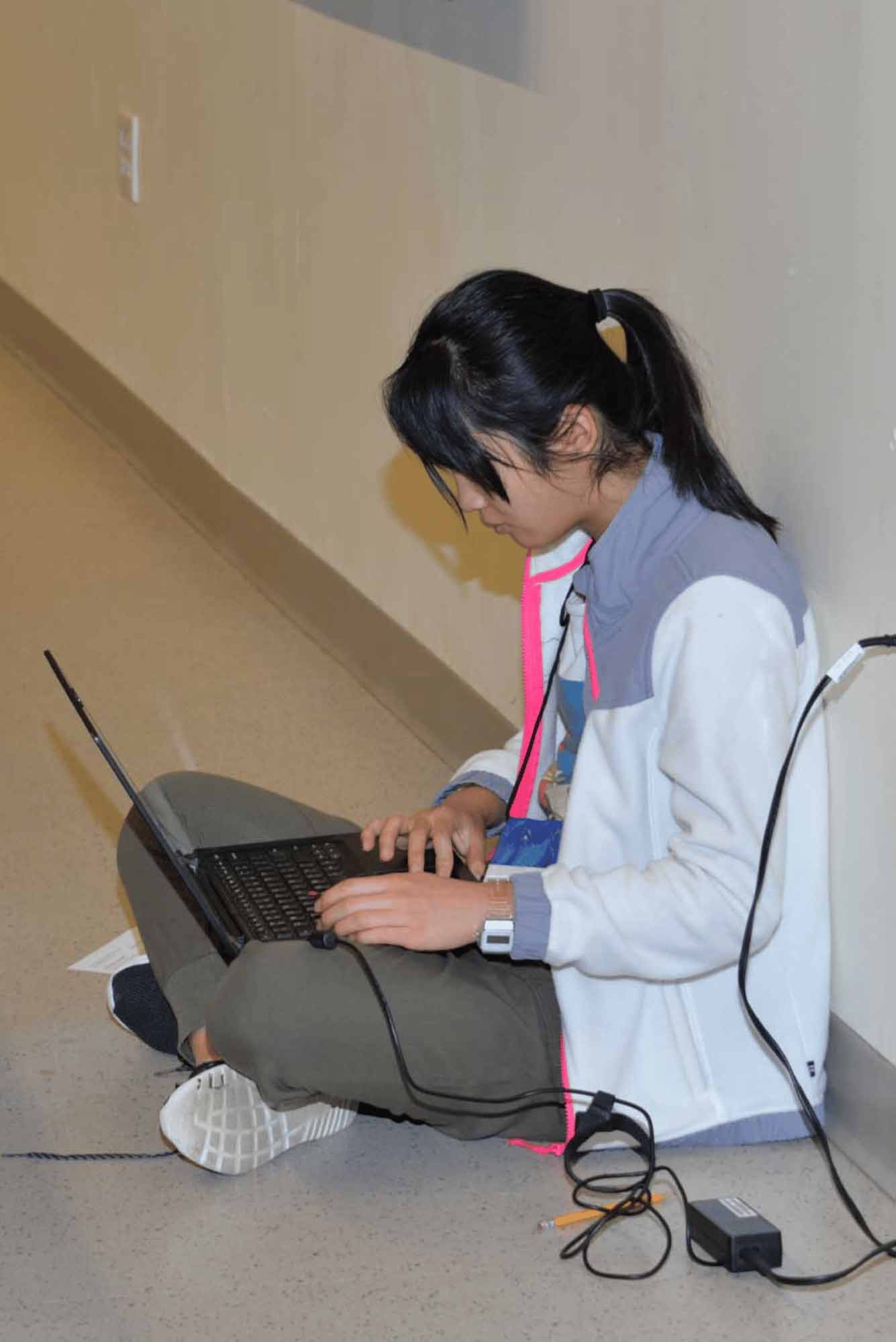 creative-writing-student-competitor-typing-computer-world-finals